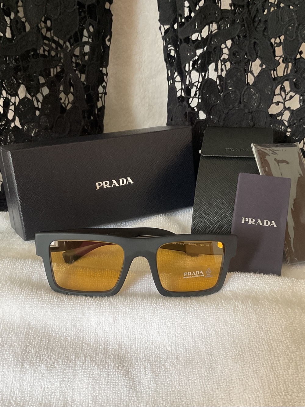 Prada Matte Black Rectangular Sunglasses with Amber Lenses
